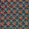 Patterned fabric with red and blue design on a dark background