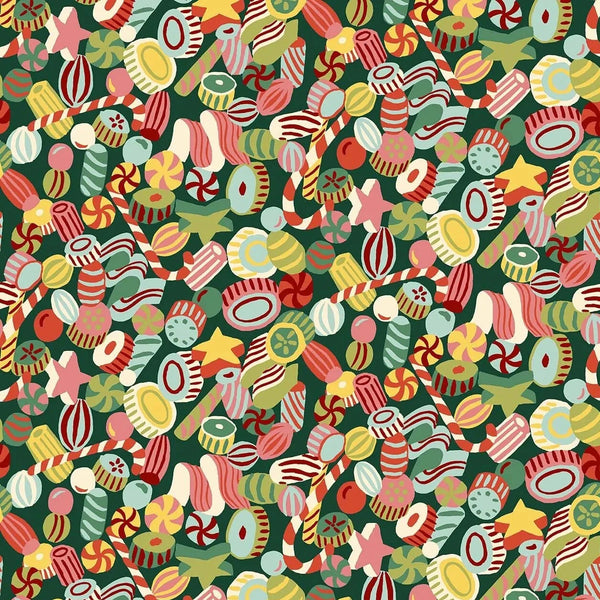 Colorful pattern of Christmas-themed candies on a green background