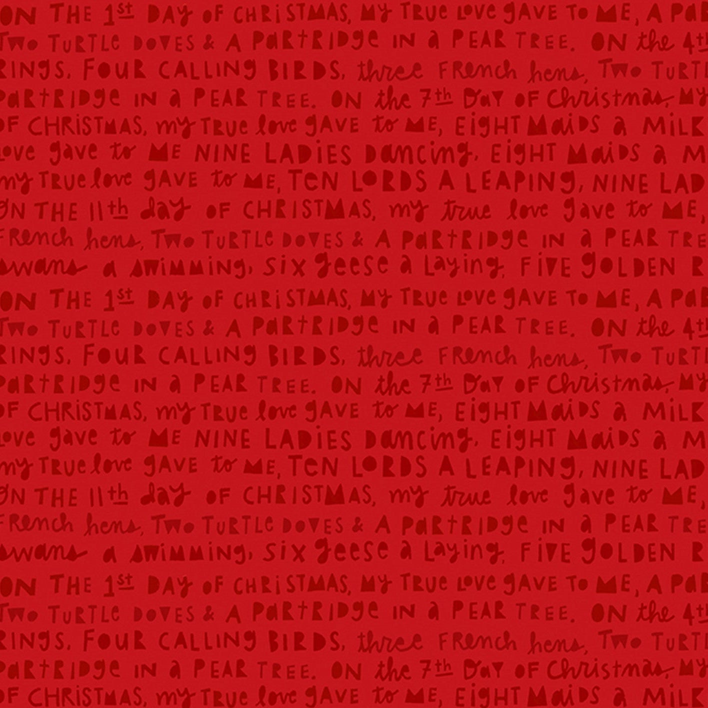 Red fabric with printed Christmas song text