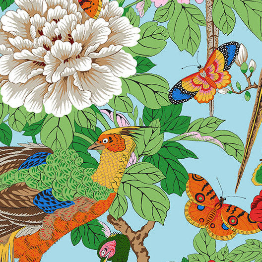 Colorful fabric pattern with birds, flowers, and leaves on a blue background