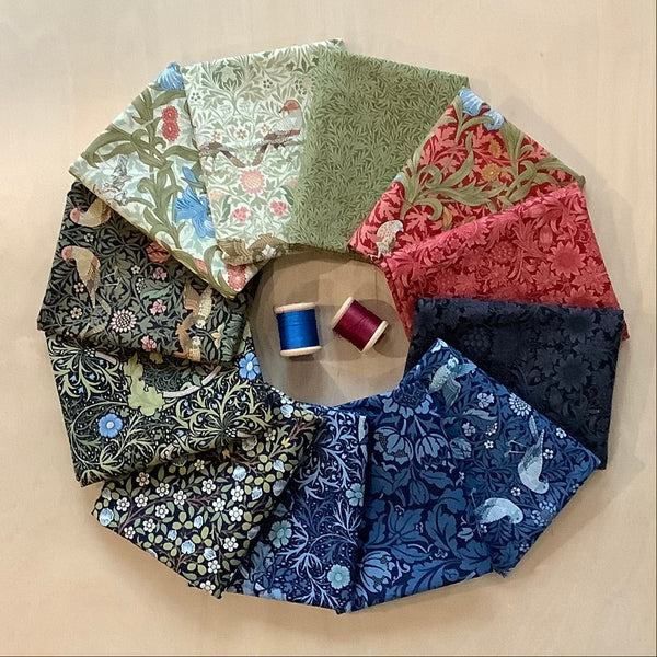 Collection of patterned fabric swatches arranged in a circular fashion on a beige surface.