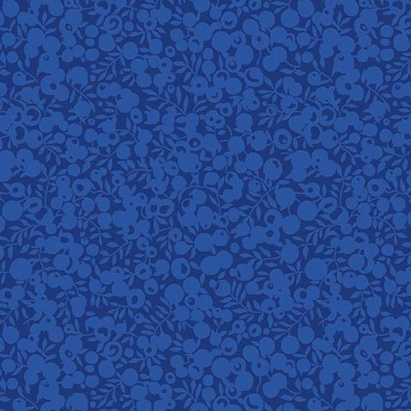 Blue fabric with a subtle pattern on a blue background