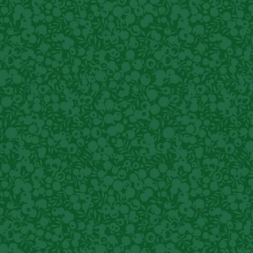 Green fabric with a subtle pattern on a green background