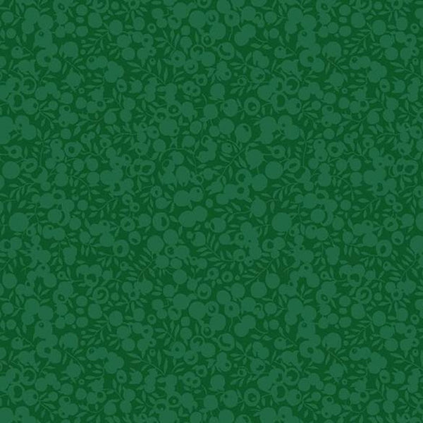 Green fabric with a subtle pattern on a green background